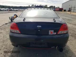 2005 Hyundai Tiburon GT с VIN KMHHN65F95U181518, выставлен на аукционе Copart как лот 41125854 с пробегом 158 863 миль миль и Списание • Salvage title. История ставок и продаж доступна на DreamBid. Изображение 6.