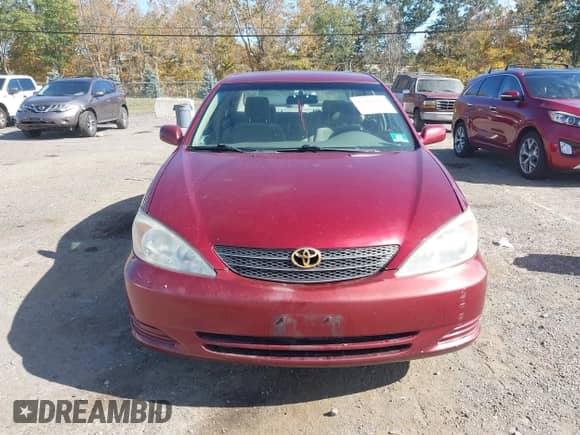 2003 Toyota Camry LE z VIN 4T1BE32K93U193977, wystawiony jako IAAI lot #43391387 z przebiegiem 84 896 mil mil oraz . Historia ofert i sprzedaży dostępna na DreamBid. Obrazek 12.