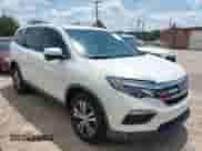 2016 Honda Pilot EX-L with VIN 5FNYF6H64GB038436, listed as a IAAI auction lot 42735200 with 165,507 mi miles and . Bid and sale history available at DreamBid. Image 1.