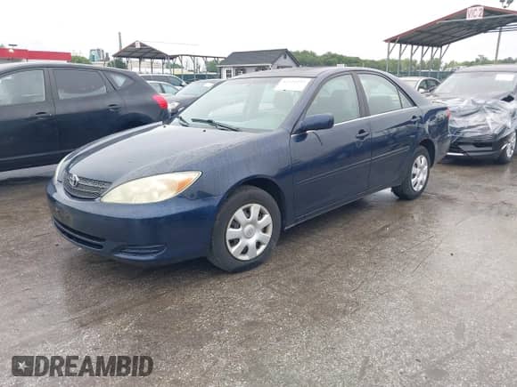 2004 Toyota Camry LE z VIN 4T1BE32K34U292540, wystawiony jako IAAI lot #42322392 z przebiegiem 159 104 mil mil oraz . Historia ofert i sprzedaży dostępna na DreamBid. Obrazek 2.