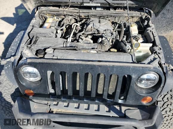 2012 Jeep Wrangler Sport z VIN 1C4AJWAG3CL258130, wystawiony jako Copart lot #86983635 z przebiegiem 154 996 mil mil oraz Czysty tytuł • Clean title. Historia ofert i sprzedaży dostępna na DreamBid. Obrazek 12.