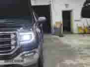 2018 GMC Sierra 1500 SLT with VIN 3GTU2NEC0JG182906, listed as a Copart auction lot 90059455 with 119,084 mi miles and Clean title. Bid and sale history available at DreamBid. Image 11.