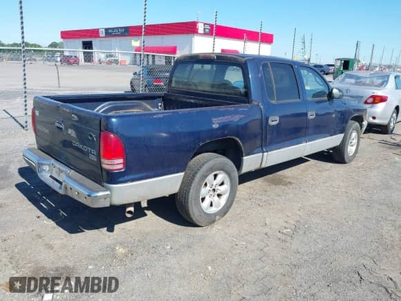 2004 Dodge Dakota SLT with VIN 1D7HL48N94S651211, listed as a IAAI auction lot 42183393 with 171,532 mi miles and . Bid and sale history available at DreamBid. Image 4.