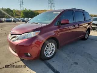 2011 Toyota Sienna XLE AAS with VIN 5TDYK3DC9BS045702, listed as a Copart auction lot 71254795 with 176,508 mi miles and Salvage title. Bid and sale history available at DreamBid. Image 1.