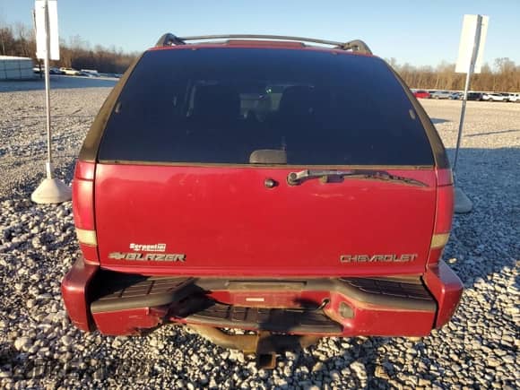 2001 Chevrolet Blazer LS z VIN 1GNCT18W51K123809, wystawiony jako Copart lot #86491294 z przebiegiem 211 514 mil mil oraz Szkoda całkowita • Salvage title. Historia ofert i sprzedaży dostępna na DreamBid. Obrazek 6.