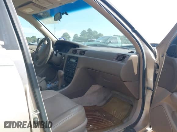 2000 Toyota Camry LE z VIN JT2BG22K1Y0455359, wystawiony jako IAAI lot #43398426 z przebiegiem 96 984 mil mil oraz . Historia ofert i sprzedaży dostępna na DreamBid. Obrazek 5.