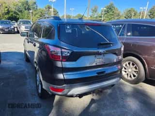 2018 Ford Escape SE with VIN 1FMCU9GD5JUD47165, listed as a IAAI auction lot 43520991 with 114,793 mi miles and . Bid and sale history available at DreamBid. Image 3.