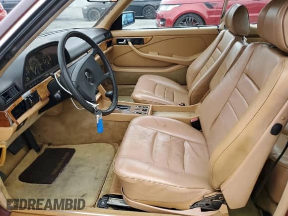 1983 Mercedes-Benz 380 SEC with VIN WDBCA43A3DB008043, listed as a Copart auction lot 65991095 with 146,606 mi miles and Salvage title. Bid and sale history available at DreamBid. Image 7.