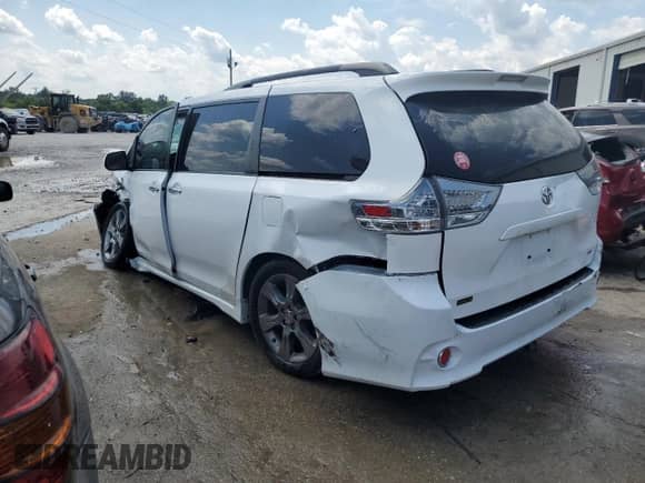 2014 Toyota Sienna SE with VIN 5TDXK3DC9ES431830, listed as a Copart auction lot 67330254 with 77,238 mi miles and Salvage title. Bid and sale history available at DreamBid. Image 2.