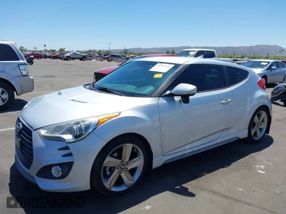 2013 Hyundai Veloster Turbo с VIN KMHTC6AE0DU177983, выставлен на аукционе IAAI как лот 42292102 с пробегом 121 142 миль миль и . История ставок и продаж доступна на DreamBid. Изображение 2.