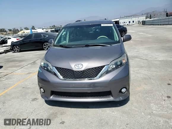 2014 Toyota Sienna SE with VIN 5TDXK3DCXES490627, listed as a Copart auction lot 69174715 with 149,966 mi miles and Salvage title. Bid and sale history available at DreamBid. Image 14.