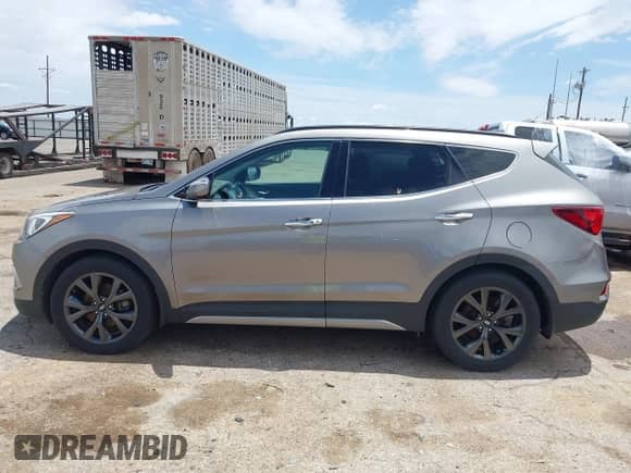 2018 Hyundai Santa Fe Ultimate with VIN 5XYZWDLAXJG531204, listed as a IAAI auction lot 42473418 with 90,726 mi miles and . Bid and sale history available at DreamBid. Image 14.