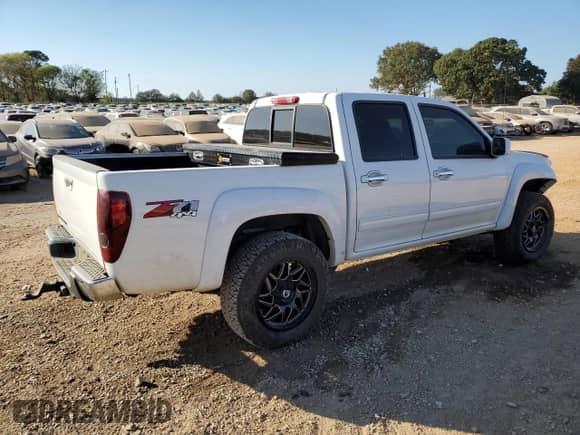 2012 Chevrolet Colorado 2LT with VIN 1GCHTDFP5C8108481, listed as a Copart auction lot 77945234 with 104,997 mi miles and Salvage title. Bid and sale history available at DreamBid. Image 3.