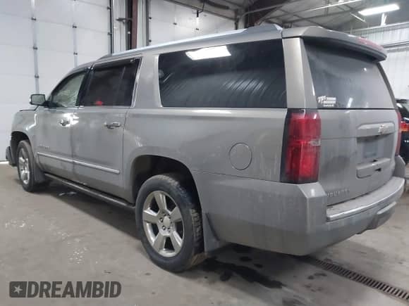 2018 Chevrolet Suburban Premier z VIN 1GNSKJKC9JR100134, wystawiony jako IAAI lot #41449255 z przebiegiem 111 528 mil mil oraz . Historia ofert i sprzedaży dostępna na DreamBid. Obrazek 3.