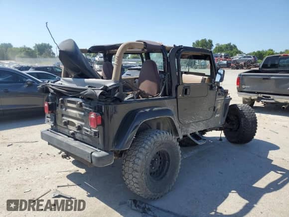 2001 Jeep Wrangler Sahara with VIN 1J4FA59S61P352141, listed as a Copart auction lot 66212355 with Not provided miles and Clean title. Bid and sale history available at DreamBid. Image 3.