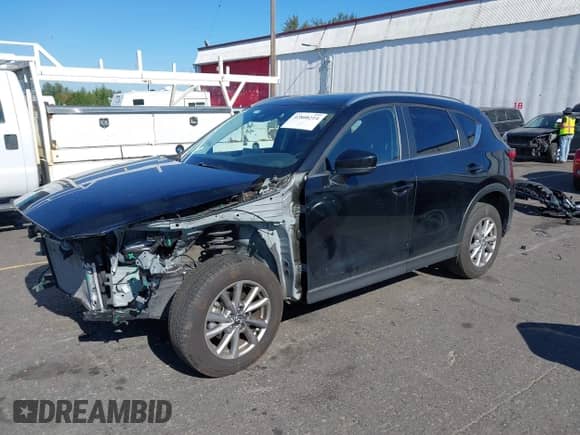 2023 Mazda CX-5 S Select z VIN JM3KFBBM7P0186768, wystawiony jako IAAI lot #42808214 z przebiegiem 16 236 mil mil oraz . Historia ofert i sprzedaży dostępna na DreamBid. Obrazek 2.