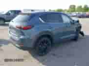 2025 Mazda CX-5 S Carbon Edition z VIN JM3KFBCM3S0689995, wystawiony jako IAAI lot #42922834 z przebiegiem 2 087 mil mil oraz . Historia ofert i sprzedaży dostępna na DreamBid. Obrazek 4.