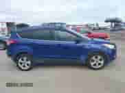 2014 Ford Escape SE z VIN 1FMCU0GX7EUB23407, wystawiony jako IAAI lot #43385821 z przebiegiem 160 838 mil mil oraz . Historia ofert i sprzedaży dostępna na DreamBid. Obrazek 13.