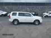 2013 Honda Pilot Touring with VIN 5FNYF4H95DB077773, listed as a IAAI auction lot 43046082 with 121,441 mi miles and . Bid and sale history available at DreamBid. Image 13.