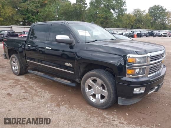 2014 Chevrolet Silverado 1500 High Country z VIN 3GCUKTEJ2EG475750, wystawiony jako IAAI lot #43555633 z przebiegiem Nie podano mil oraz . Historia ofert i sprzedaży dostępna na DreamBid. Obrazek 1.