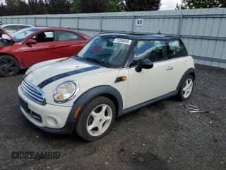 2011 MINI Hardtop with VIN WMWSU3C57BT091448, listed as a Copart auction lot 71254655 with 108,600 mi miles and Salvage title. Bid and sale history available at DreamBid. Image 1.