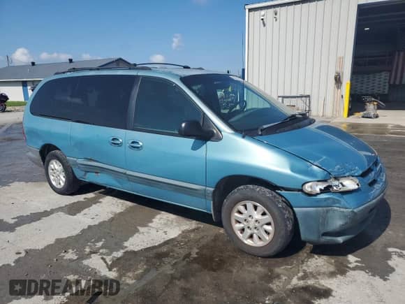 1999 Dodge Caravan SE with VIN 2B4GP44G9XR204463, listed as a Copart auction lot 64301385 with 291,785 mi miles and Salvage title. Bid and sale history available at DreamBid. Image 4.