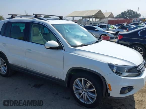 2015 Volkswagen Tiguan S with VIN WVGAV7AX4FW501176, listed as a IAAI auction lot 42983584 with 138,074 mi miles and . Bid and sale history available at DreamBid. Image 6.