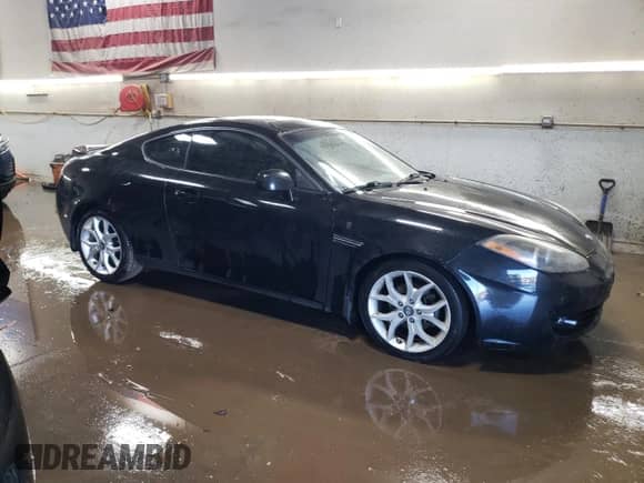 2008 Hyundai Tiburon GT with VIN KMHHN66F38U279074, listed as a Copart auction lot 87723645 with 125,280 mi miles and Salvage title. Bid and sale history available at DreamBid. Image 4.