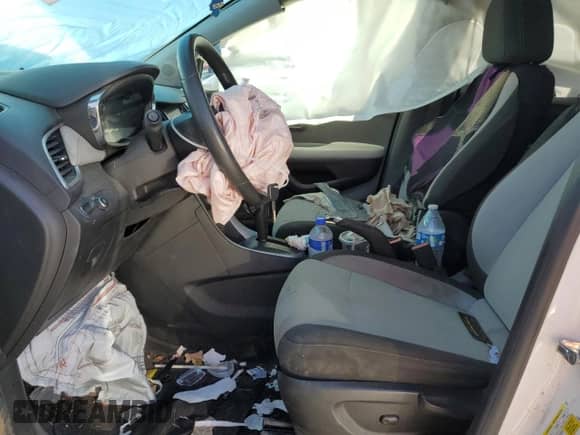 2021 Chevrolet Trax LS с VIN KL7CJKSBXMB306411, выставлен на аукционе Copart как лот 68082365 с пробегом 129 613 миль миль и Списание • Salvage title. История ставок и продаж доступна на DreamBid. Изображение 7.