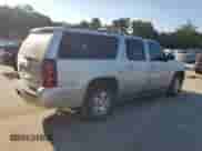 2011 Chevrolet Suburban LT с VIN 1GNSCJE09BR121047, выставлен на аукционе Copart как лот 71432645 с пробегом 188 387 миль миль и Списание • Salvage title. История ставок и продаж доступна на DreamBid. Изображение 3.