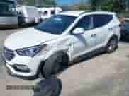 2017 Hyundai Santa Fe 2.4L z VIN 5NMZUDLB3HH029892, wystawiony jako IAAI lot #43049357 z przebiegiem 107 077 mil mil oraz . Historia ofert i sprzedaży dostępna na DreamBid. Obrazek 2.