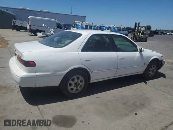 1997 Toyota Camry LE с VIN JT2BG22K3V0042340, выставлен на аукционе Copart как лот 67252935 с пробегом 216 842 миль миль и Списание • Salvage title. История ставок и продаж доступна на DreamBid. Изображение 3.