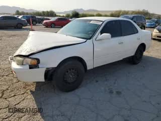 1995 Toyota Camry LE with VIN 4T1SK12E8SU548580, listed as a Copart auction lot 64808935 with 166,718 mi miles and Salvage title. Bid and sale history available at DreamBid. Image 1.