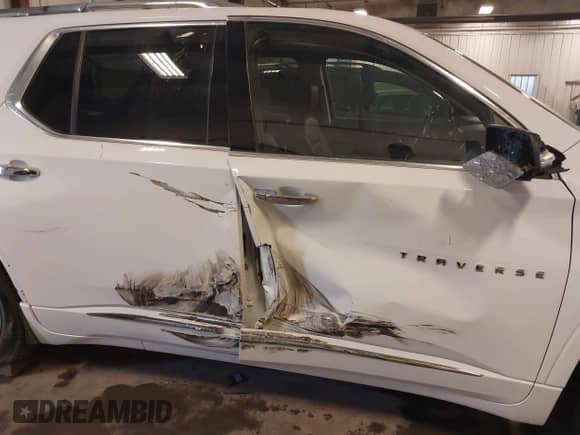 2021 Chevrolet Traverse Premier with VIN 1GNEVKKW8MJ259346, listed as a IAAI auction lot 41810312 with 80,474 mi miles and . Bid and sale history available at DreamBid. Image 6.