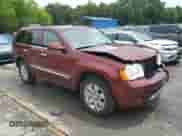 2008 Jeep Grand Cherokee Overland with VIN 1J8HR68208C210683, listed as a Copart auction lot 65153735 with 100,802 mi miles and Salvage title. Bid and sale history available at DreamBid. Image 4.