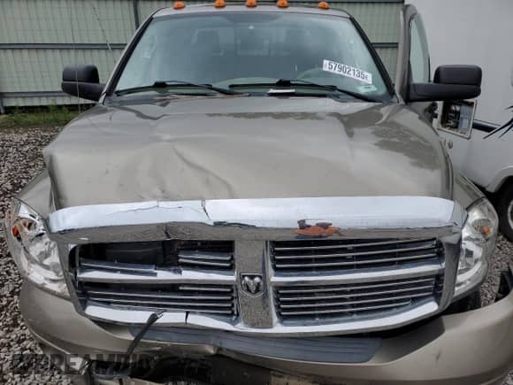 2006 Dodge 3500 Laramie z VIN 3D7LX39CX6G175616, wystawiony jako Copart lot #57902135 z przebiegiem 183 961 mil mil oraz Szkoda całkowita • Salvage title. Historia ofert i sprzedaży dostępna na DreamBid. Obrazek 11.