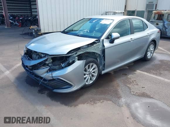 2023 Toyota Camry LE with VIN 4T1C11AK1PU115527, listed as a IAAI auction lot 43097637 with 23,926 mi miles and . Bid and sale history available at DreamBid. Image 2.