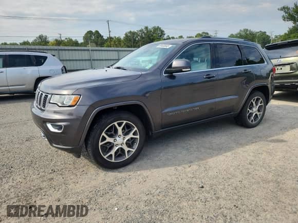 2018 Jeep Grand Cherokee Sterling with VIN 1C4RJEBG4JC145179, listed as a Copart auction lot 69403845 with 106,658 mi miles and Salvage title. Bid and sale history available at DreamBid. Image 1.