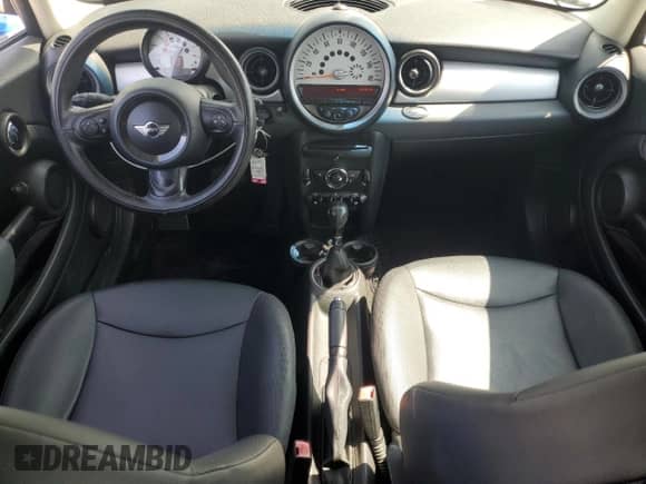 2011 MINI Hardtop with VIN WMWSU3C52BT096248, listed as a Copart auction lot 62008285 with 129,794 mi miles and Salvage title. Bid and sale history available at DreamBid. Image 8.
