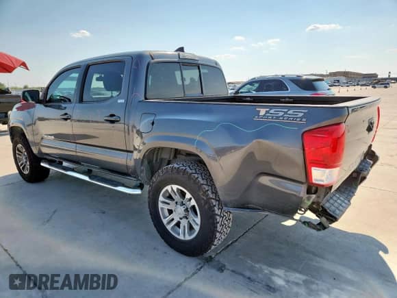 2016 Toyota Tacoma TRD Off Road с VIN 3TMAZ5CN8GM006585, выставлен на аукционе Copart как лот 70260245 с пробегом 94 079 миль миль и Списание • Salvage title. История ставок и продаж доступна на DreamBid. Изображение 2.