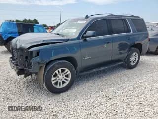 2019 Chevrolet Tahoe LS z VIN 1GNSKAKCXKR370099, wystawiony jako Copart lot #70914855 z przebiegiem 83 535 mil mil oraz Szkoda całkowita • Salvage title. Historia ofert i sprzedaży dostępna na DreamBid. Obrazek 1.