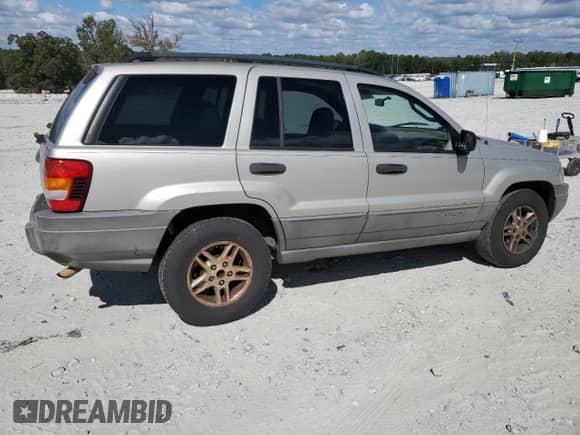 2004 Jeep Grand Cherokee Laredo with VIN 1J4GX48S64C302687, listed as a Copart auction lot 85599075 with 213,057 mi miles and Salvage title. Bid and sale history available at DreamBid. Image 3.