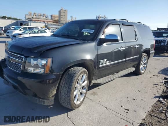 2011 Chevrolet Suburban LTZ with VIN 1GNSCKE05BR320599, listed as a Copart auction lot 64181955 with 196,199 mi miles and Salvage title. Bid and sale history available at DreamBid. Image 1.