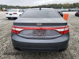 2013 Hyundai Azera z VIN KMHFH4JG2DA255430, wystawiony jako Copart lot #79411144 z przebiegiem 207 750 mil mil oraz Szkoda całkowita • Salvage title. Historia ofert i sprzedaży dostępna na DreamBid. Obrazek 6.
