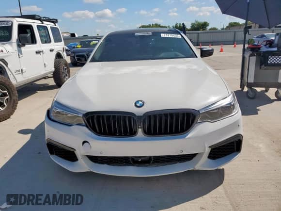 2018 BMW 5 Series M550i xDrive with VIN WBAJB9C54JB034746, listed as a Copart auction lot 71218435 with 128,279 mi miles and Clean title. Bid and sale history available at DreamBid. Image 5.