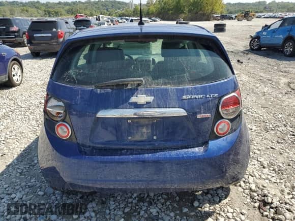 2014 Chevrolet Sonic LTZ with VIN 1G1JE6SB7E4131264, listed as a Copart auction lot 70743035 with 130,070 mi miles and Salvage title. Bid and sale history available at DreamBid. Image 6.
