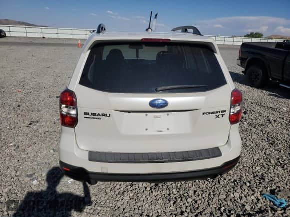 2014 Subaru Forester XT Touring with VIN JF2SJGMC0EH421231, listed as a Copart auction lot 65372135 with 117,057 mi miles and Salvage title. Bid and sale history available at DreamBid. Image 6.