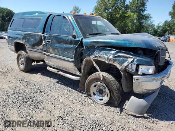 1998 Dodge RAM with VIN 3B7KF26D9WM220885, listed as a Copart auction lot 63468695 with 102,002 mi miles and Salvage title. Bid and sale history available at DreamBid. Image 4.