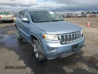 2012 Jeep Grand Cherokee Overland Summit z VIN 1C4RJFCT7CC328869, wystawiony jako IAAI lot #43166534 z przebiegiem 123 745 mil mil oraz . Historia ofert i sprzedaży dostępna na DreamBid. Obrazek 1.