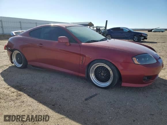 2006 Hyundai Tiburon GS с VIN KMHHM65D56U211049, выставлен на аукционе Copart как лот 44816025 с пробегом 123 030 миль миль и Списание • Salvage title. История ставок и продаж доступна на DreamBid. Изображение 4.